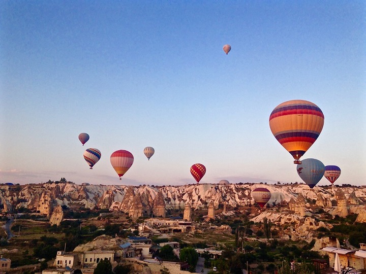 Hot air balloons over rock formations