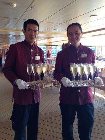 cruise crew with champagne glasses