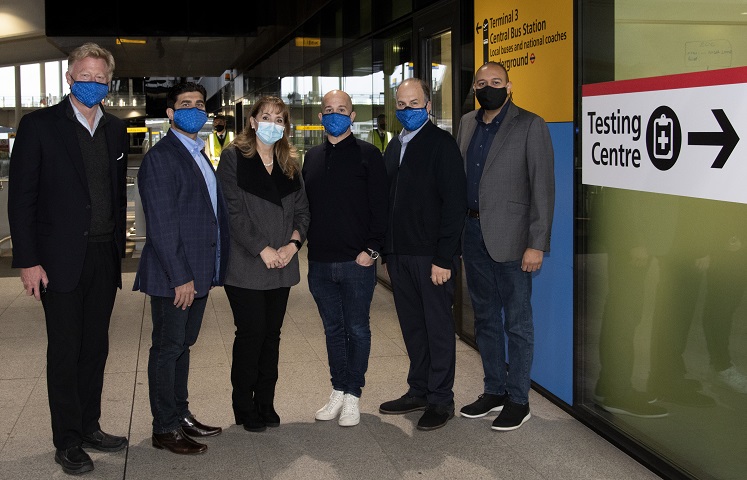 group of travelers wearing masks