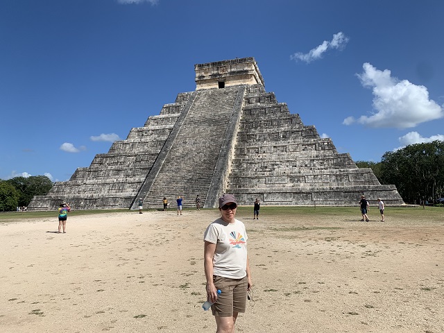 woman in front of pyramid